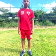 Former street boy with donated football boots