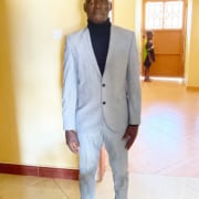 A boy from the streets of Kampala dressed for his Prom night