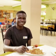 One of the charity's boys having breakfast before work