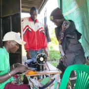 Former homeless boy from Kampala now working as a tailor