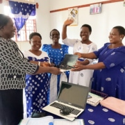 Delivering donated laptops to the Mothers' Union in Uganda