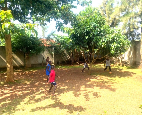 Children playing football at the charity home in Garuga