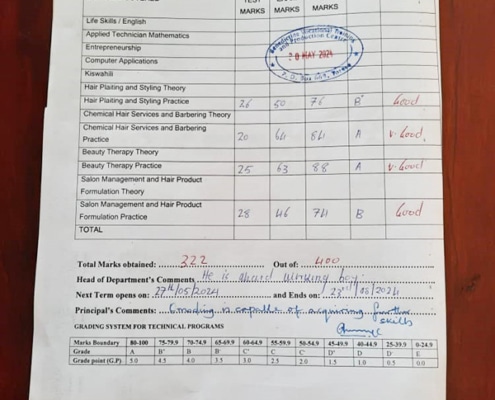Great school report of a former street boy in Kampala